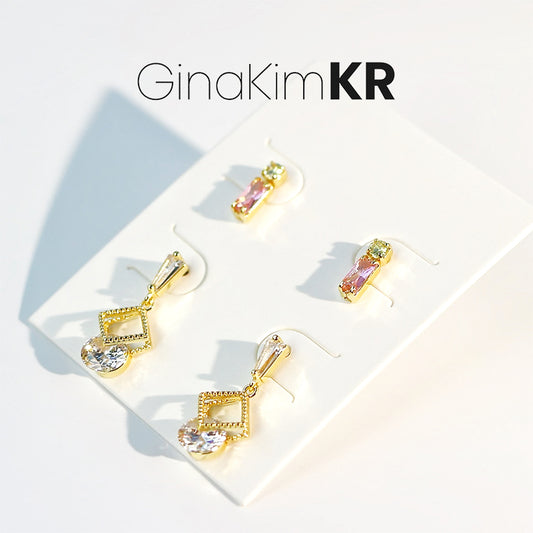 Front view of Dewlight Earring Set with all three gold and pearl earrings displayed on white card, branded GinaKimKR.