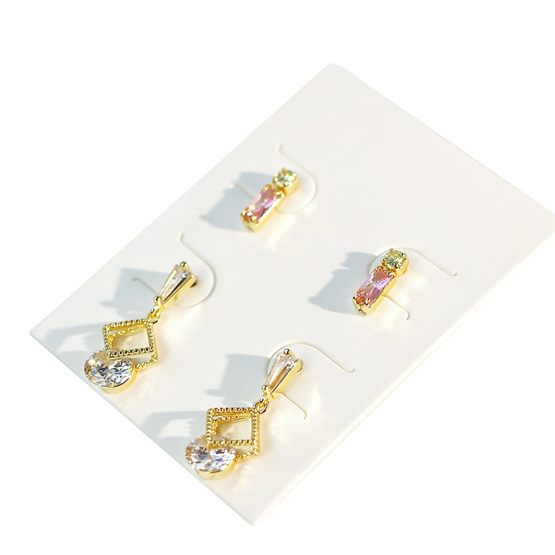 Detailed shot of gold and pearl earrings from GinaKimKR Dewlight Set, arranged in soft daylight for elegant tone.