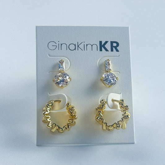 Elegant ripple-textured gold and CZ drop earrings displayed on the official GinaKimKR card. A perfect match of sparkle and style.