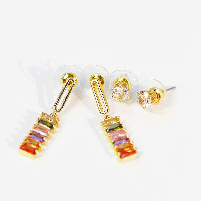 Front view of Lightfall Duo gold earrings with multicolor crystal beads, arranged symmetrically on white background.