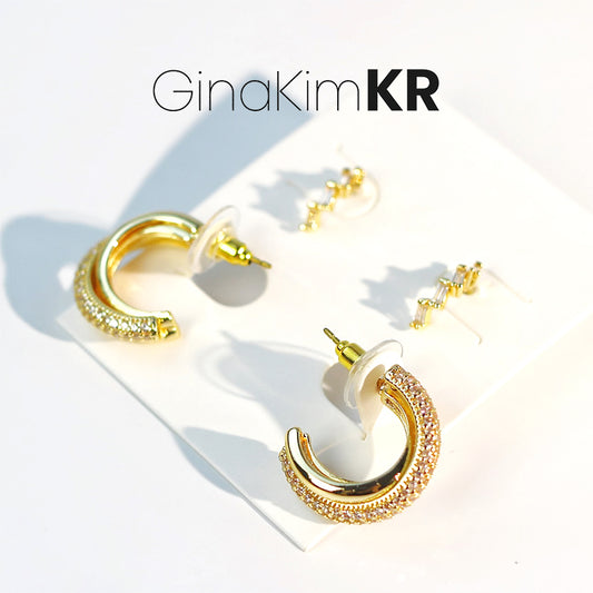 GinaKimKR Luna Curve Earring Set shown on branded card with three curved gold earrings displayed neatly.