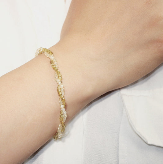 GinaKim Olive Prism Bracelet shown on wrist, combining earthy green beads and golden accents for a calm, nature-inspired and elegant everyday look.