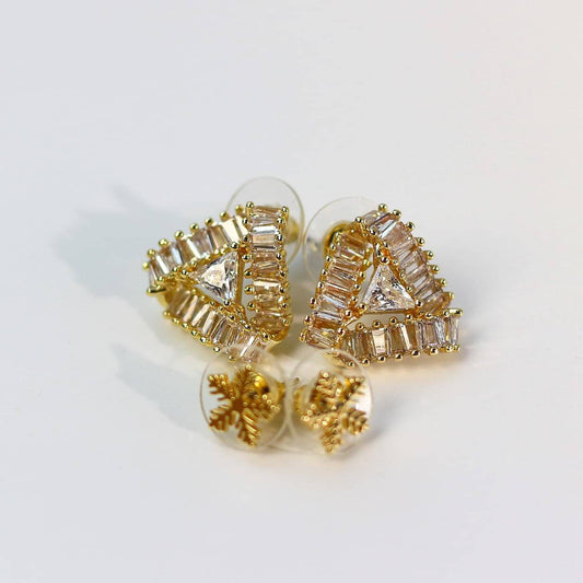 Close-up of gold-tone floral crystal stud earrings with faceted multi-prism texture from Snow Prism Set.