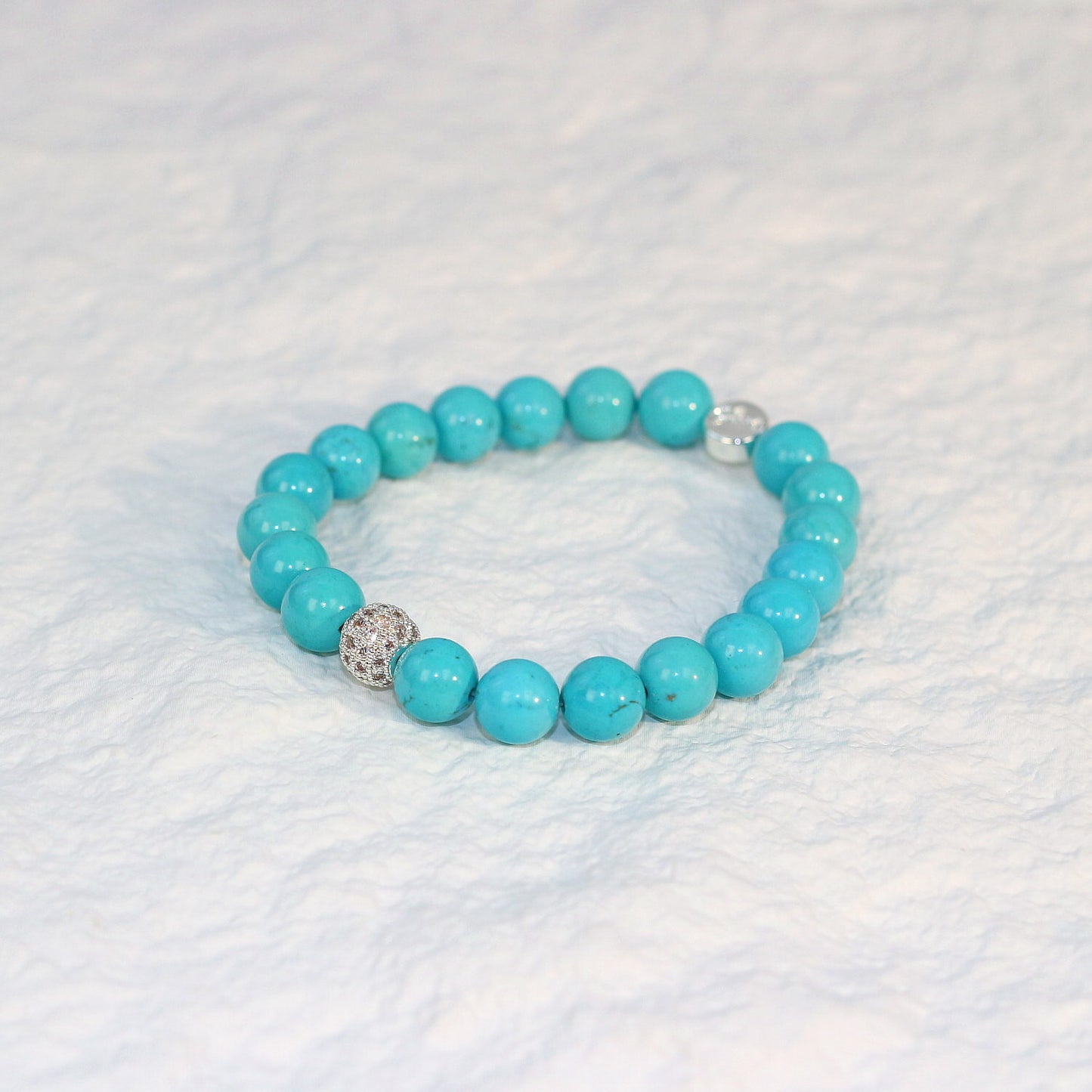 Flat-lay view of the Turquoise Strength Bracelet with even spacing and rich blue tone, symbolizing protection and inner strength.