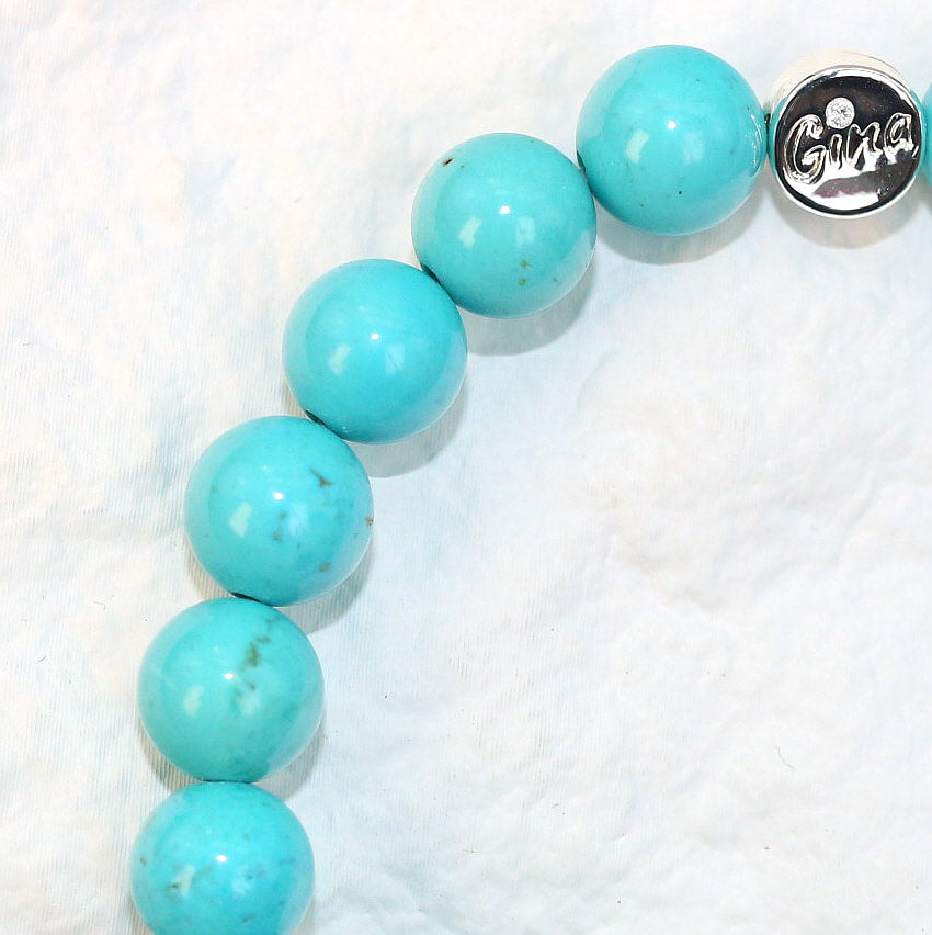 Close-up side shot highlighting the vivid blue color and smooth surface of the 8mm turquoise beads, emphasizing bold yet calming energy.