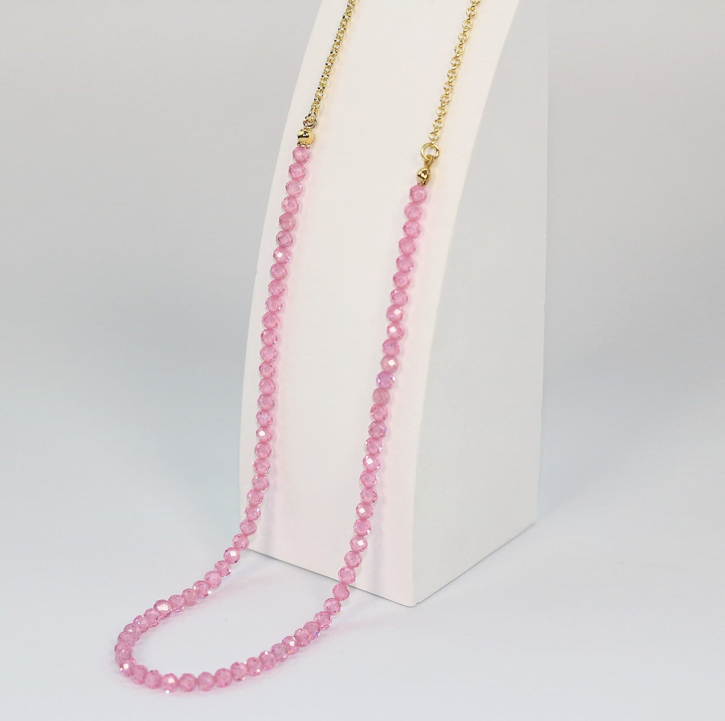 Detail shot of 4mm pink CZ faceted beads and clasp of the Blossom Light Necklace