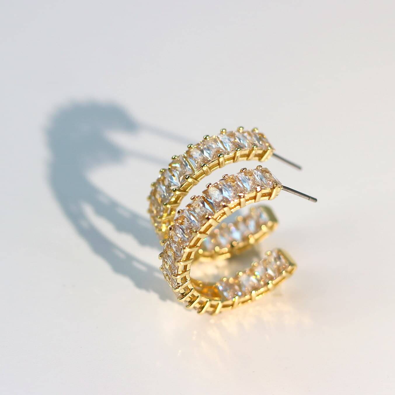 Overhead photo of Celeste Crown Earrings fully set with 3×5mm CZ stones.