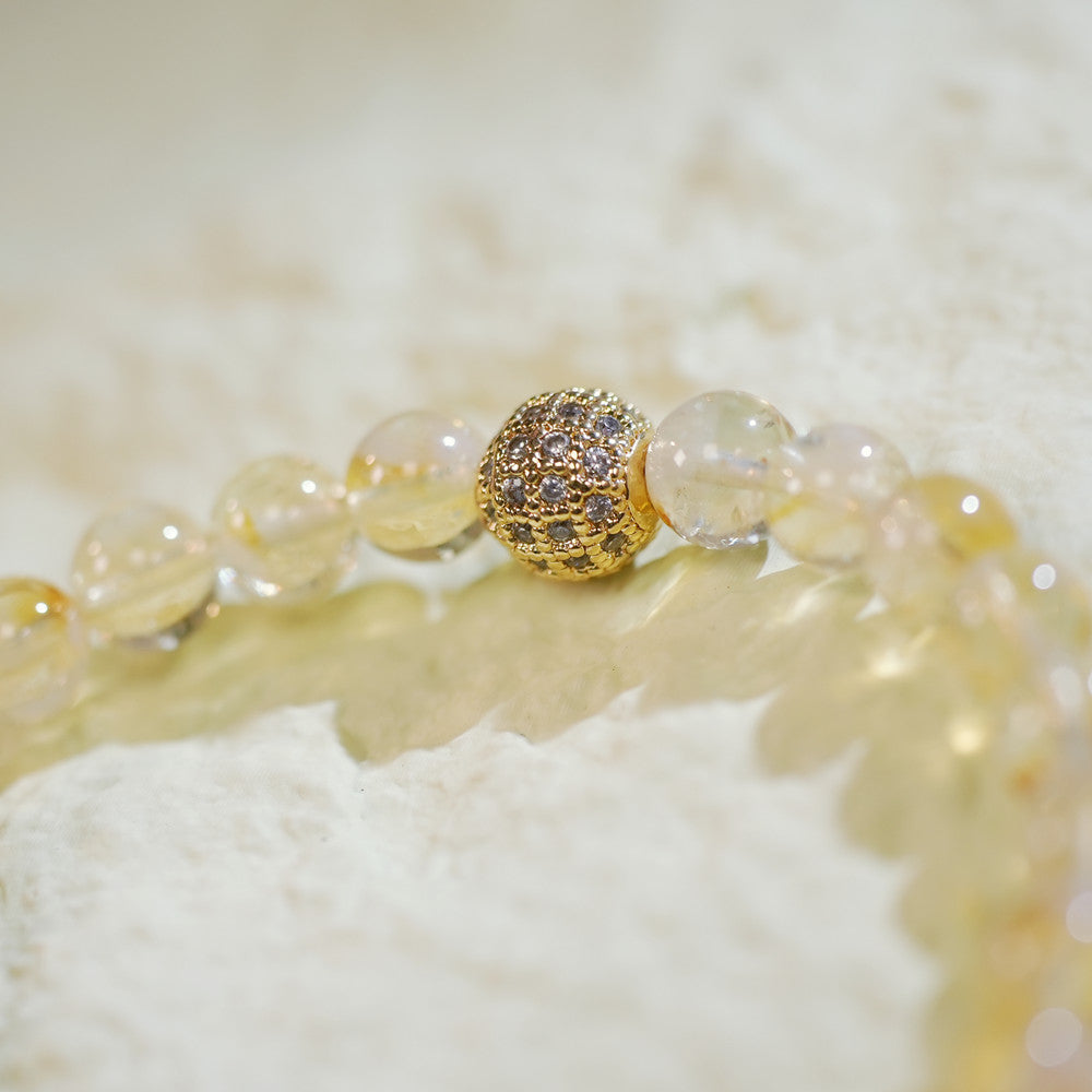Close-up of the Citrine Fortune Bracelet showing faceted yellow citrine beads, sparkling CZ bead, and GinaKimKR charm. Designed for positivity and clarity.