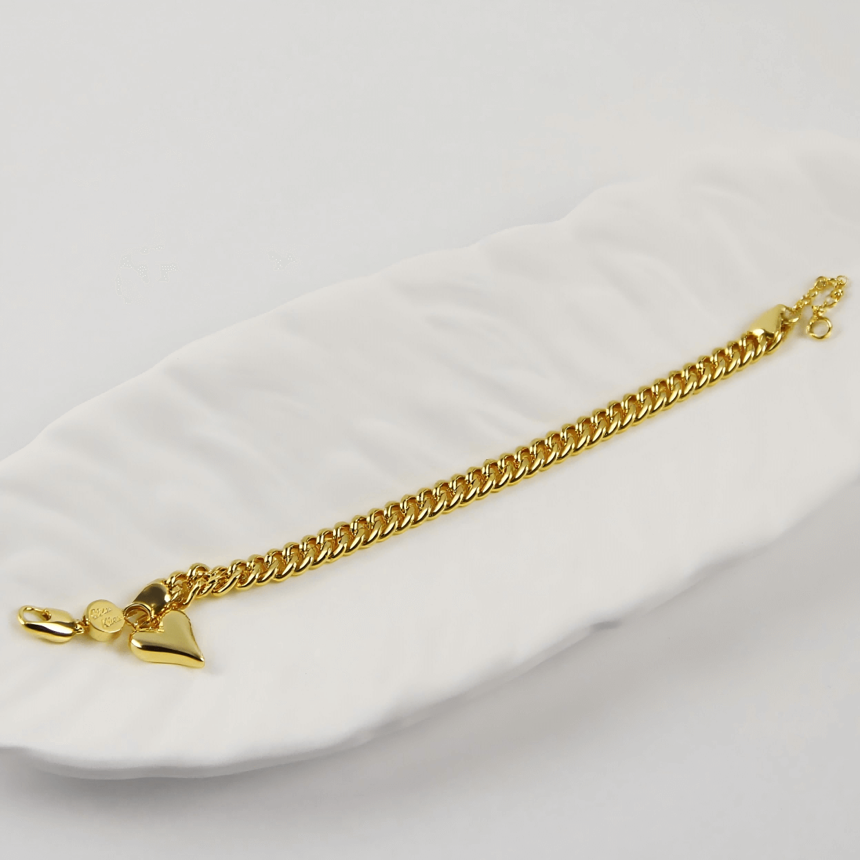 Flatlay of Evergold Twin-Link Heart Bracelet | by GinaKimKR with gold plating and lobster claw clasp.