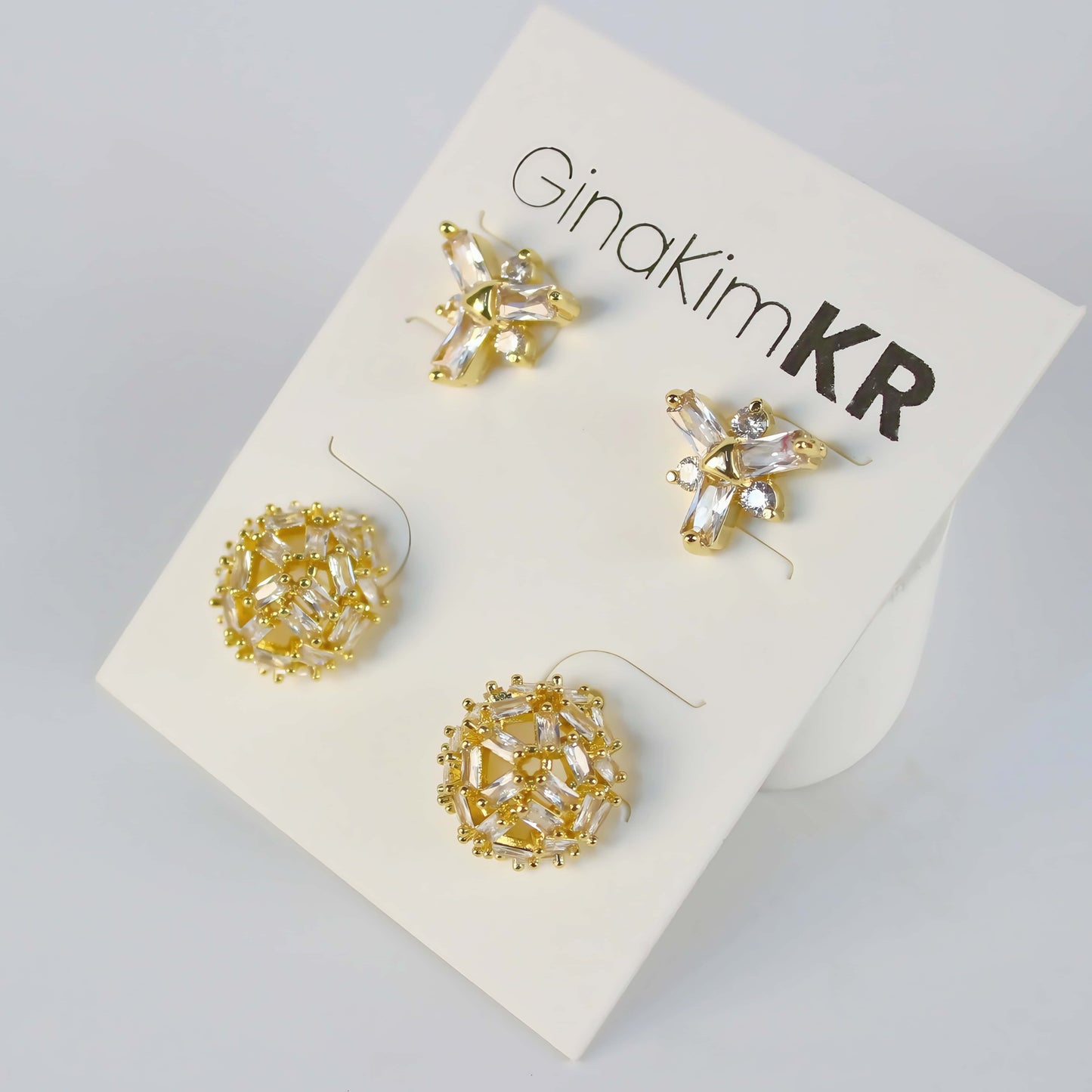 Frostlight Earring Set by GinaKimKR featuring snowflake CZ studs and crystal dome stud earrings, 14K gold plated