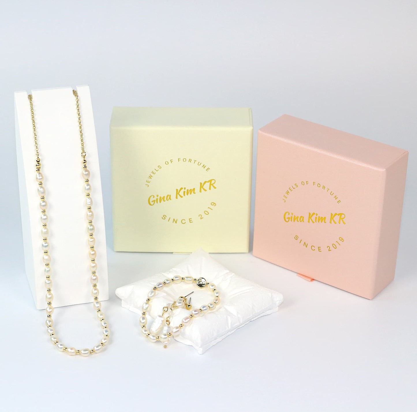 Gina Kim pearl jewelry gift set featuring necklace, Pearl Whisper Bracelet, and baroque earrings in elegant gift box