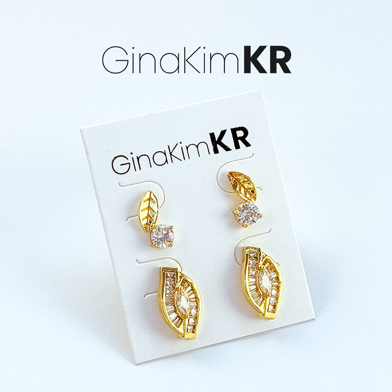 Harmony Leaf Trio Earrings neatly displayed with GinaKimKR logo visible, emphasizing refined brand aesthetic.