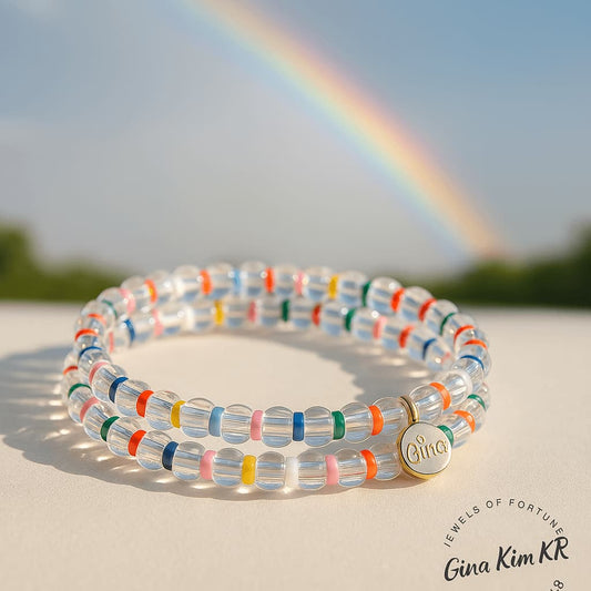 Close-up of the Joy Light Bracelet by GinaKimKR, showing crystal quartz and rainbow beads in a cheerful, luminous arrangement.