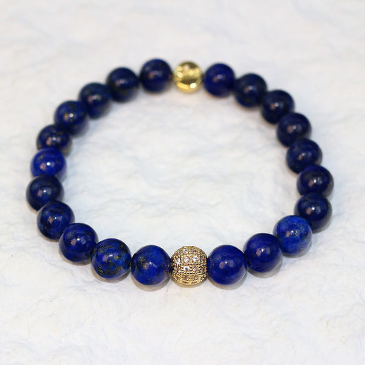 Flat-lay image of the Lapis Strength Bracelet with richly pigmented blue stones and subtle golden inclusions, symbolizing wisdom and truth.