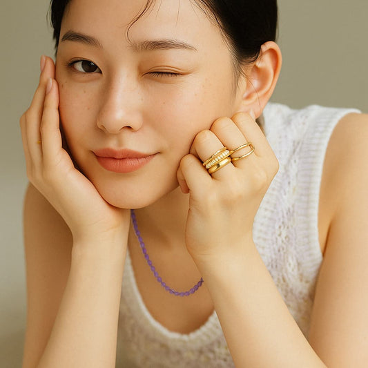 Korean woman wearing the Lavender Light Necklace in soft natural light, highlighting the elegant lavender tone and minimalist design.