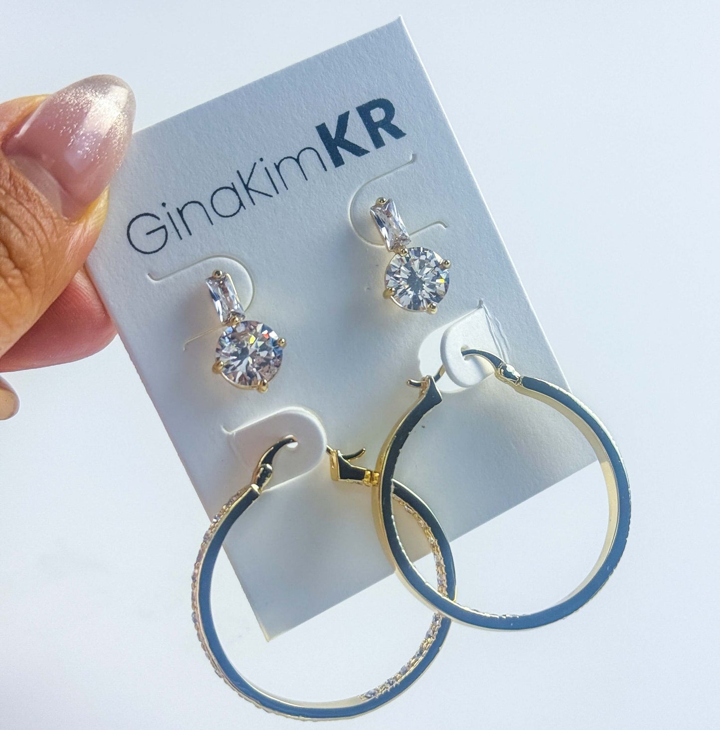 Close-up handheld image of Luna Spark Earring Set highlighting CZ sparkle and hoop shine