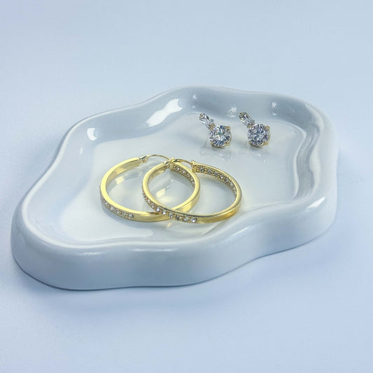GinaKimKR earring set displayed in white tray, featuring gold hoops and CZ drop studs in a premium presentation
