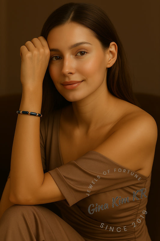 Model wearing the Midnight Focus Onyx bracelet. A minimalist unisex jewelry piece elegantly adorning the wrist