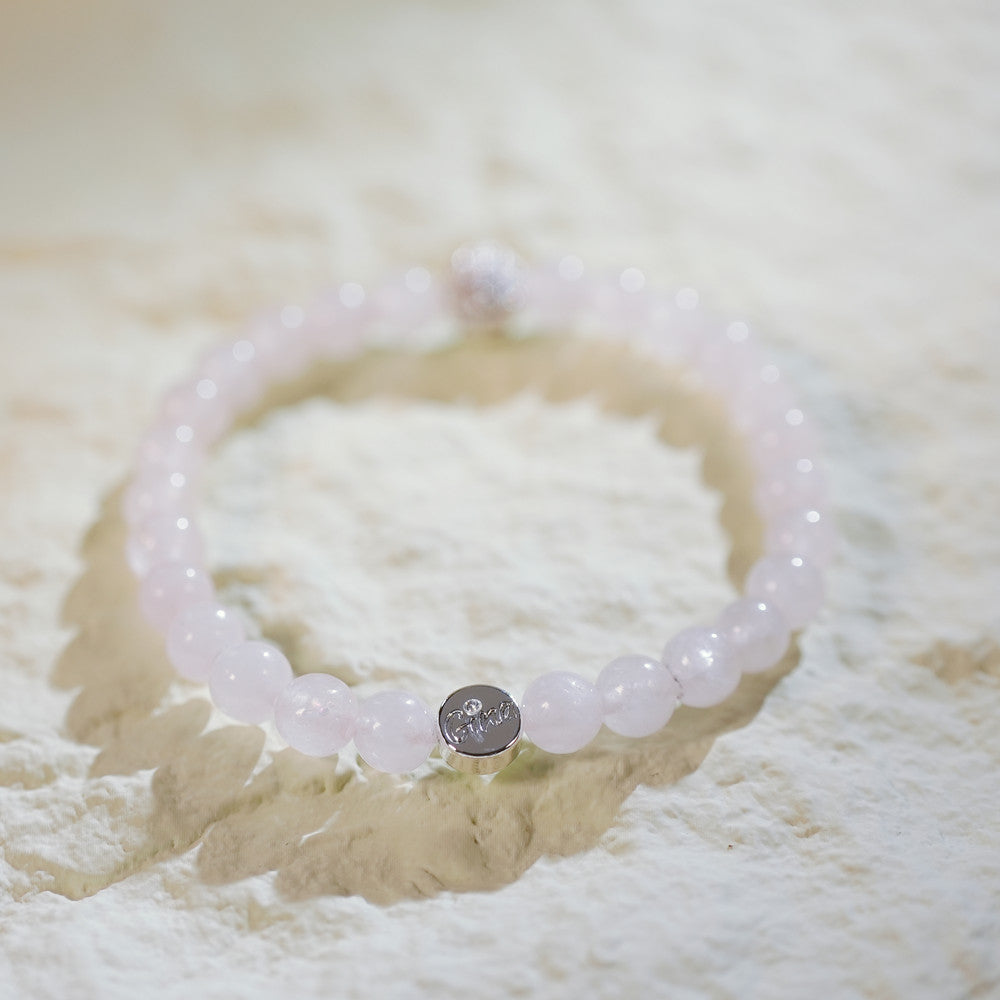 Handmade rose quartz bracelet with gold accents and CZ bead. A gentle and symbolic design by GinaKimKR for self-love and peace.