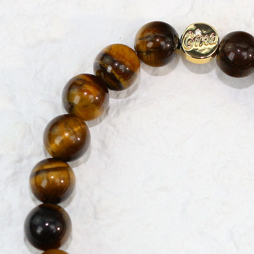 Close-up side angle of 8mm Tiger’s Eye beads, emphasizing the stone’s shimmering banding effect and deep natural coloring.