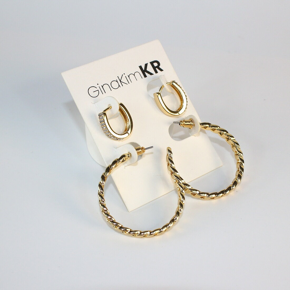 Urban Gleam Duo earrings by GinaKimKR displayed on white jewelry card – chain and crystal set