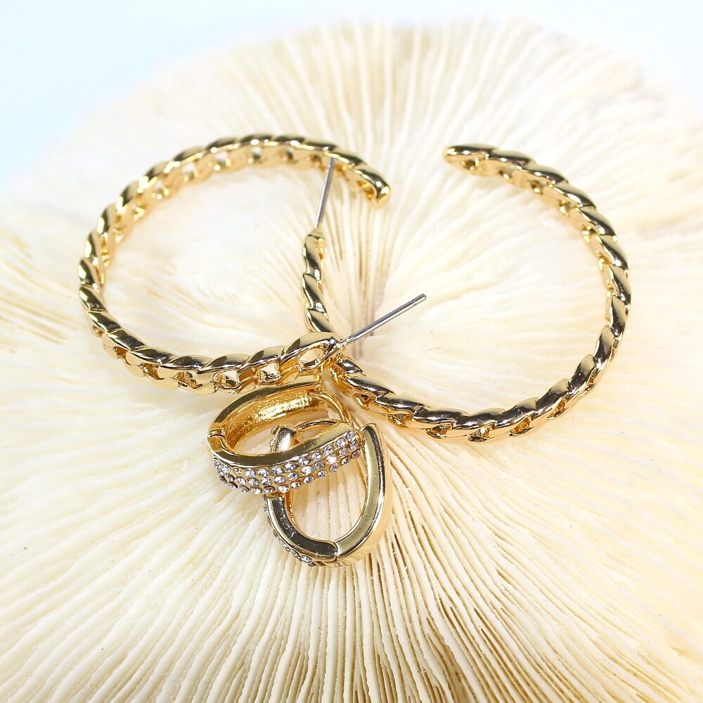 Layered composition of Urban Gleam Duo earrings – texture contrast between gold chain and pavé CZ