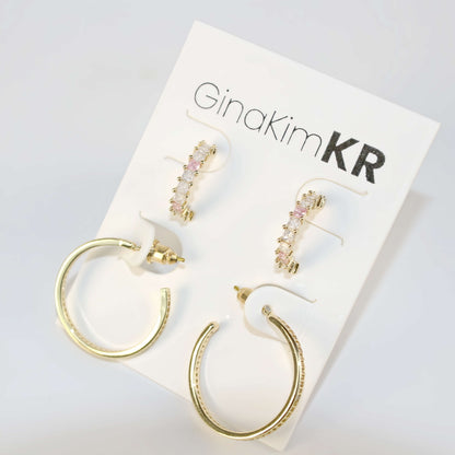 Flat lay of GinaKimKR Blush Beam Set with circular and bar-shaped gold earrings arranged elegantly for product detail.