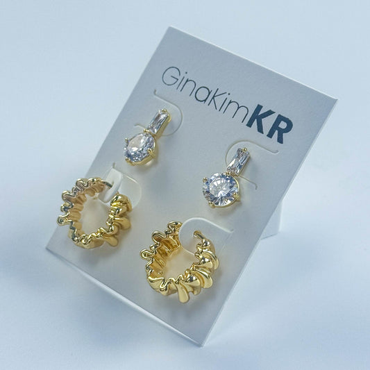 Angled display of the ripple-textured earrings on GinaKimKR branding card, highlighting their premium design details.