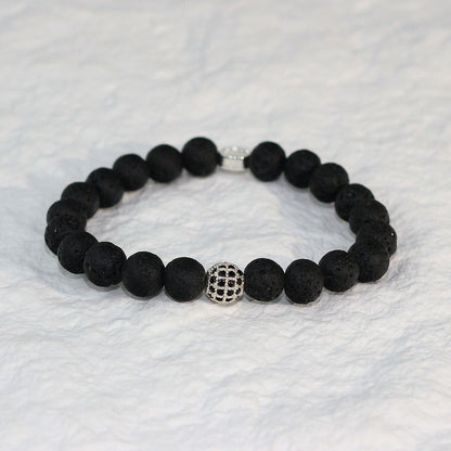 Front-facing image of the Lava Strength Bracelet with deep black volcanic beads, emphasizing balance, grounding energy, and rugged natural appeal.