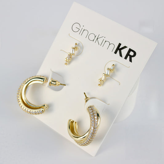 Luna Curve Earring Set on product card, featuring gold crescent and minimalist hoop designs under soft lighting.