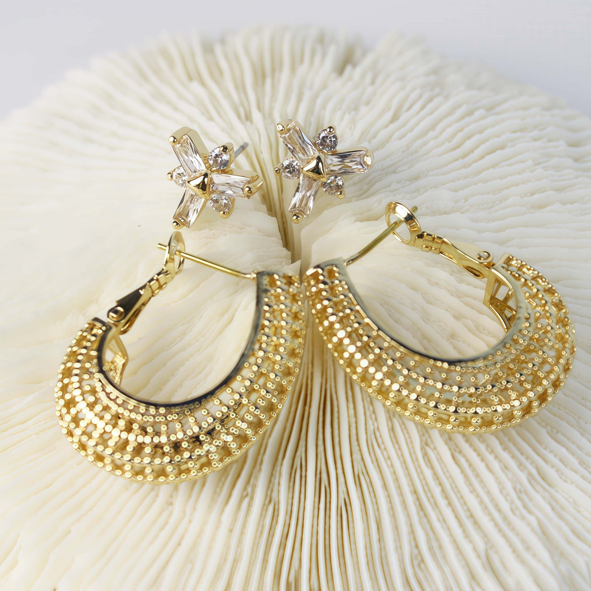 Front-facing view of gold beaded hoop earrings and CZ floral studs on ivory coral base – Royal Glow Duo Earring Set by GinaKimKR