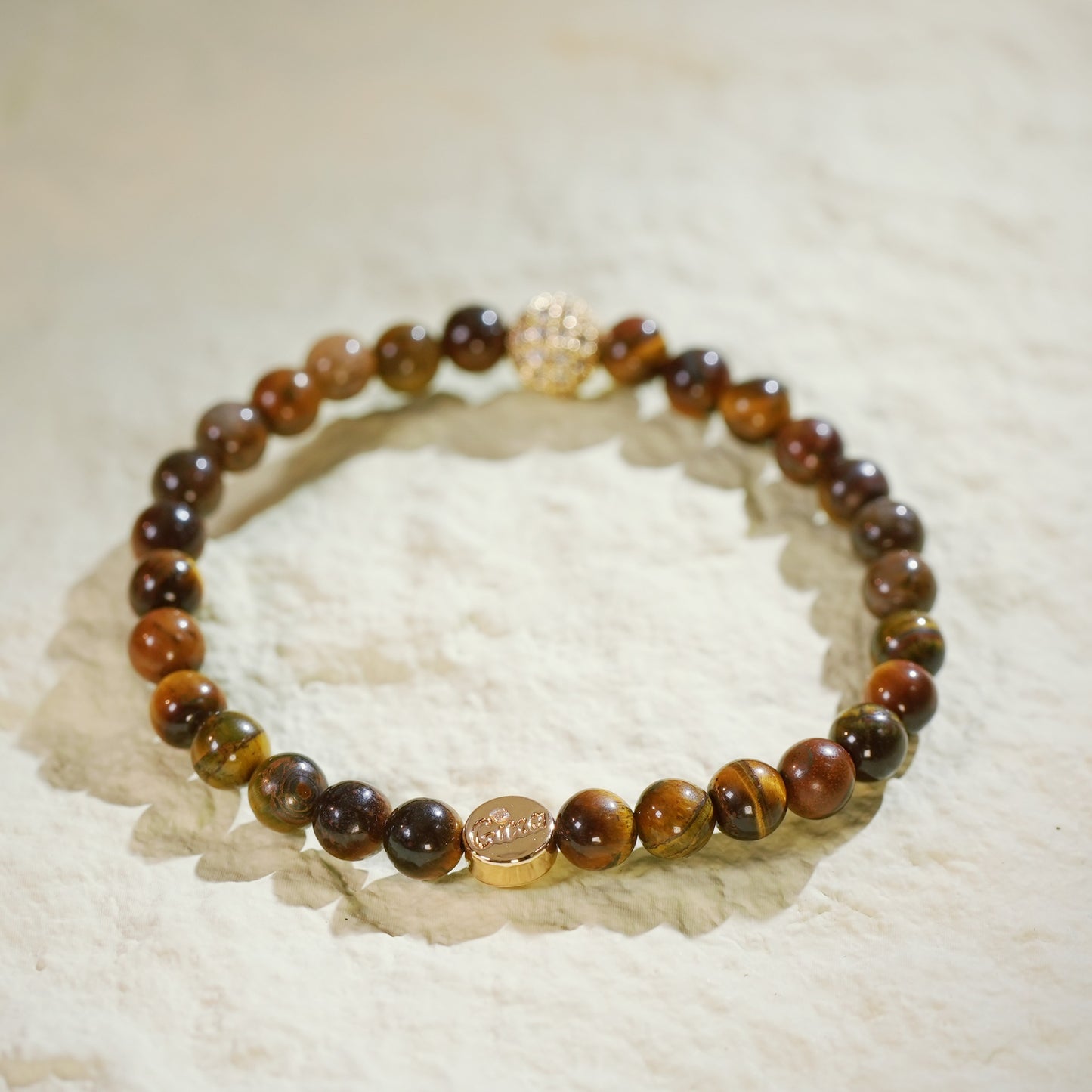 GinaKim Basic Fortune Stretch Bracelet with natural Tiger's Eye beads, featuring gold-tone CZ accents for a luxurious and empowering look, designed for comfort and balance