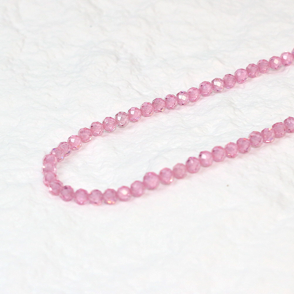 Detail shot of 4mm pink CZ faceted beads and clasp of the Blossom Light Necklace