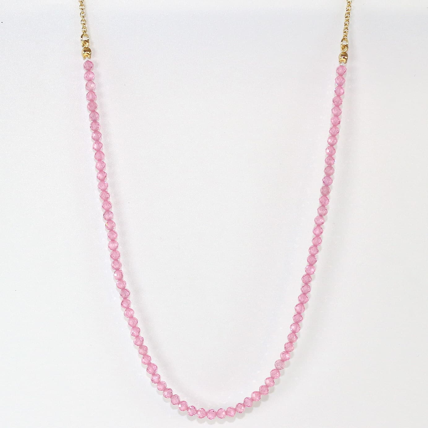 Full view of Blossom Light Necklace with pink CZ beads and gold chain