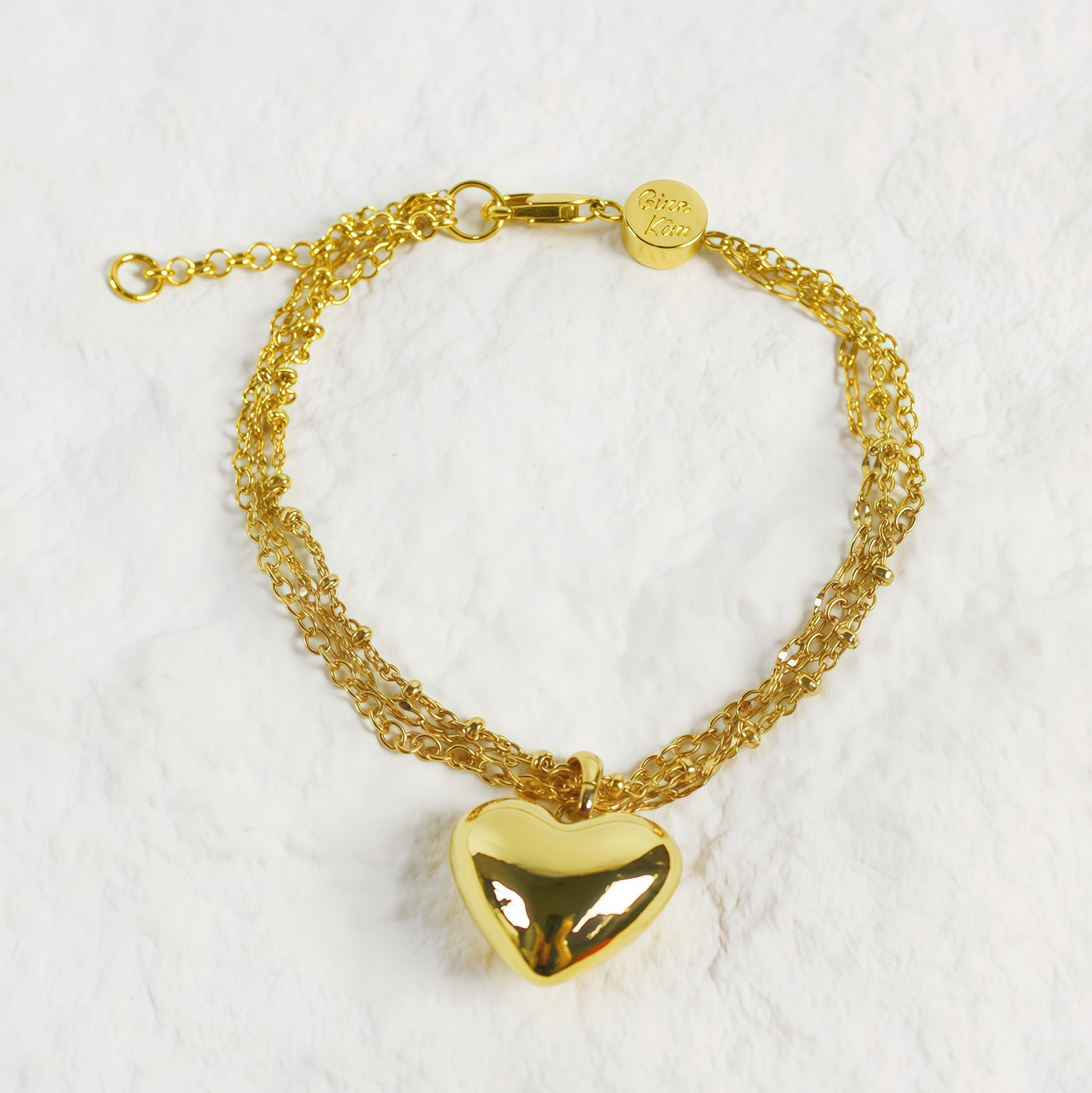 Evergold Triple Chain Heart Bracelet front view with polished gold heart charm