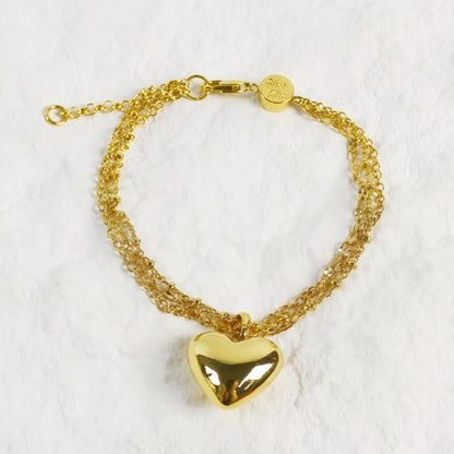 Evergold Triple Chain Heart Bracelet front view with polished gold heart charm