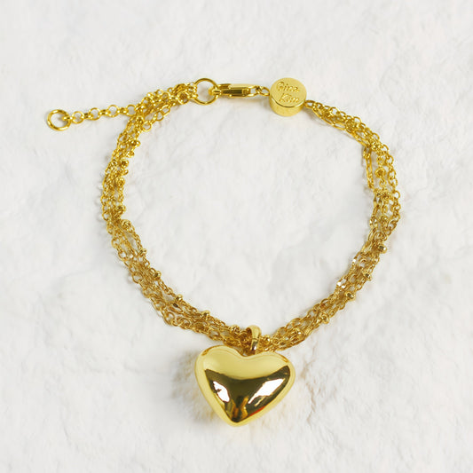 Evergold Triple Chain Heart Bracelet front view with polished gold heart charm