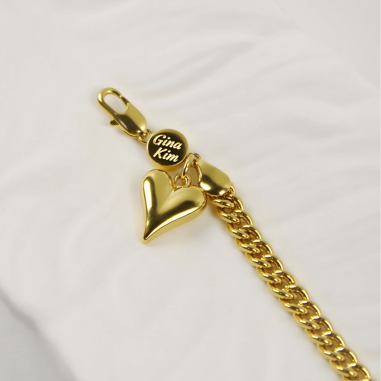 Detailed view of Evergold Twin-Link Heart Bracelet | by GinaKimKR highlighting sculpted heart charm.