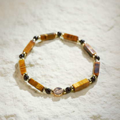 GinaKim Focus Strength Bracelet featuring natural Tiger's Eye and Onyx beads, with gold-plated accents and a stretch design for a luxurious, empowering look