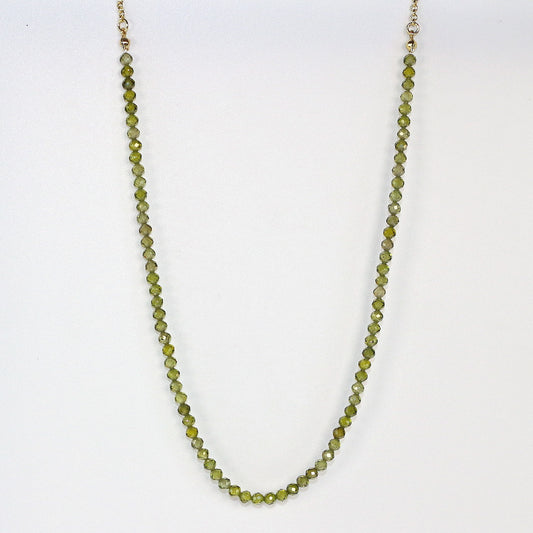 A forest green CZ necklace with faceted beads and gold-toned accents. Elegant and calming, handmade by Gina Kim Jewelry.