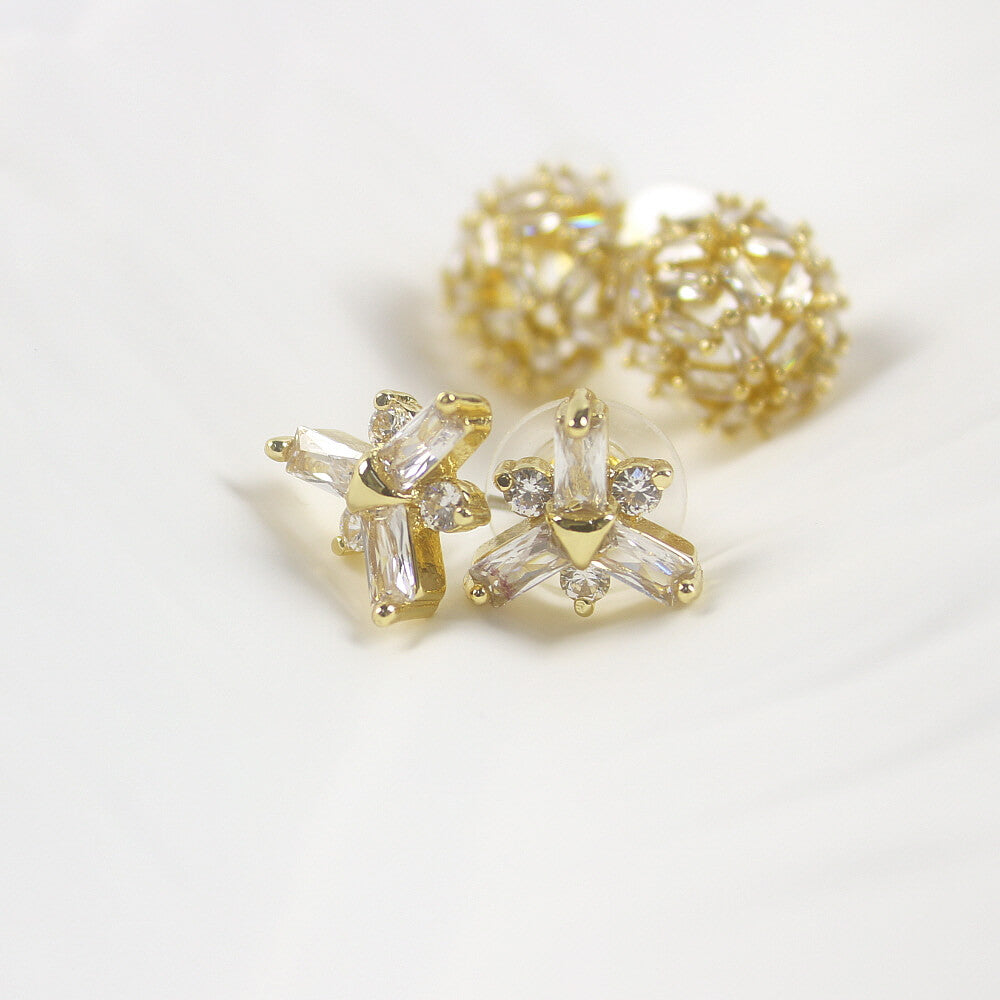 Frostlight duo earrings highlighting snowflake CZ studs with dome studs in background, GinaKimKR jewelry