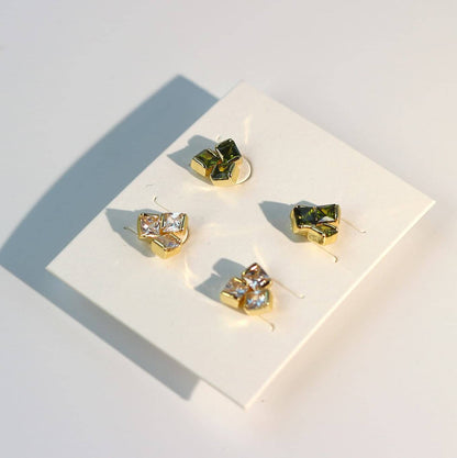 Side-angled photo of triangle-shaped CZ earrings from Geo Trio Set, highlighting post and stud design.