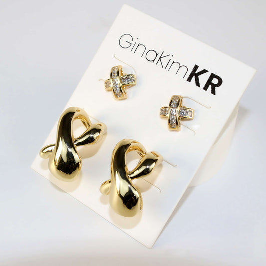  Soft-lit image of Eternal Flow Earring Set on a white display card, highlighting contrast between minimal curves and detailed CZ texture.