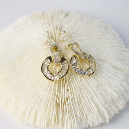 Top view of GinaKimKR’s Golden Edge Duo earrings, showing CZ triangle studs and gold crystal loops