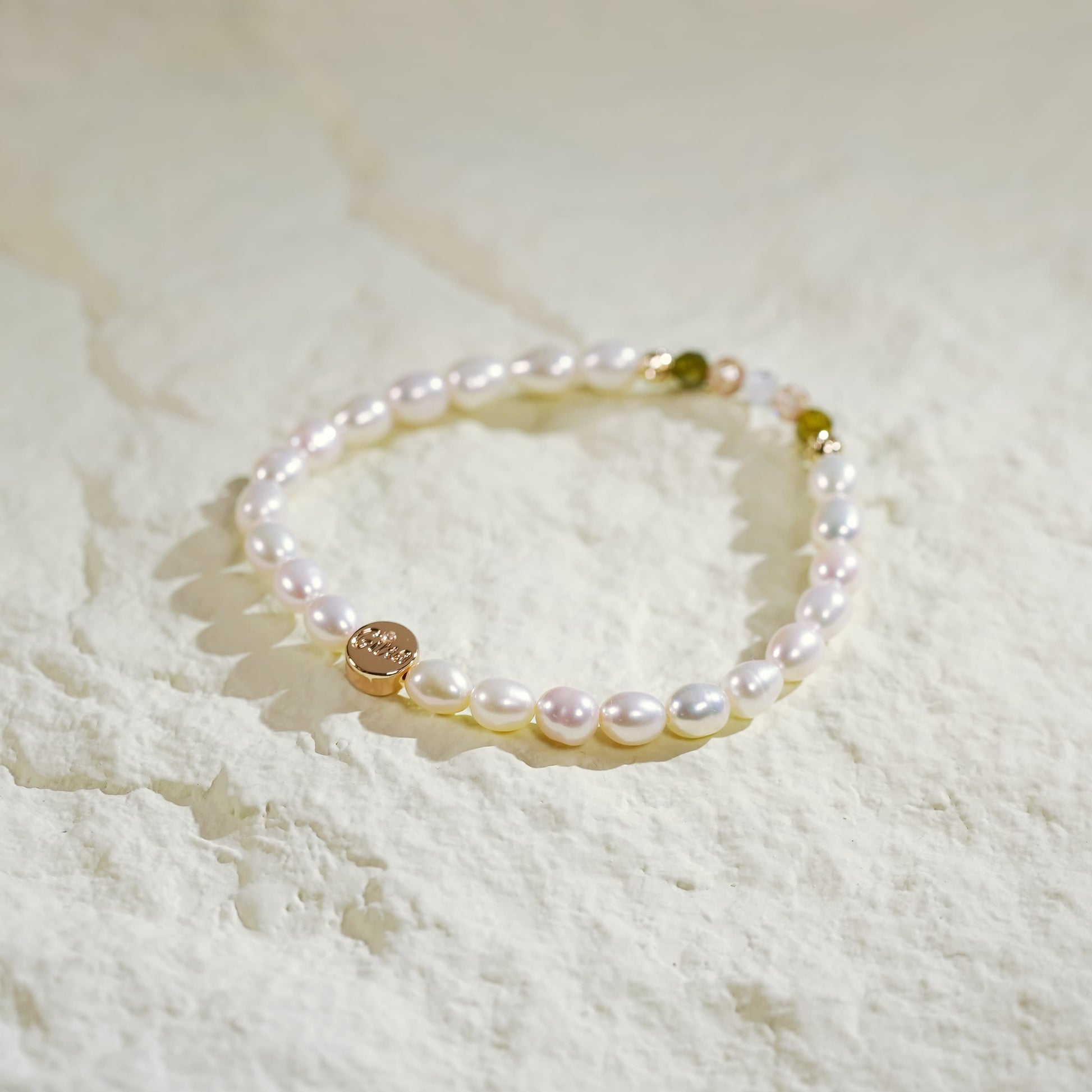 Flat-lay view of the Harmony Light Bracelet with gold accents and round pearls, highlighting its delicate balance of light, texture, and Korean handmade detail.