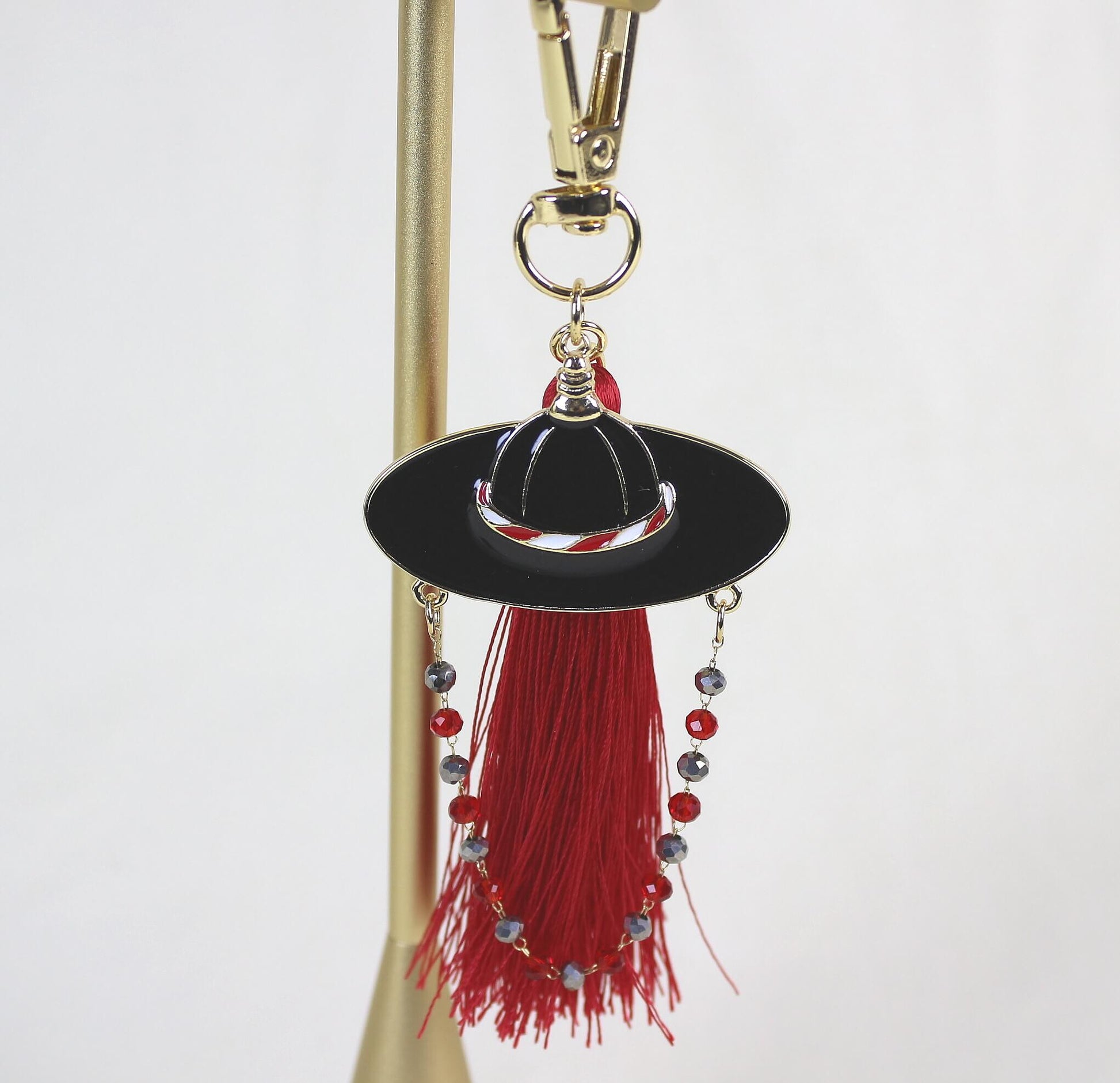 Close up of the Joseon Crimson Guardian Key Ring highlighting the Korean Satto hat shape and crimson tassel detail.