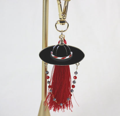 Close up of the Joseon Crimson Guardian Key Ring highlighting the Korean Satto hat shape and crimson tassel detail.