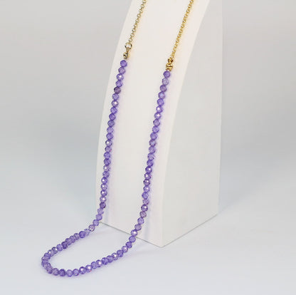 Close-up of sparkling 4mm purple CZ beads on the Lavender Light Necklace, showing detailed texture and color.