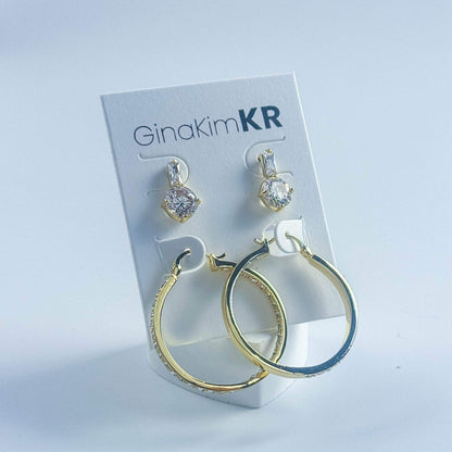 Front view of GinaKimKR Luna Spark Earring Set with pavé gold hoops and round CZ drop studs on display card