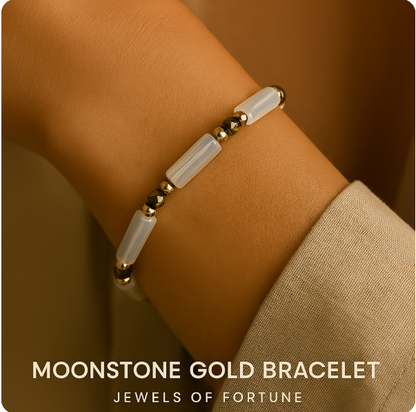A woman wearing the Lunar Light Stretch Bracelet by Gina Kim, showcasing moonstone's soft glow and deep green CZ sparkle in a modern, luxurious style